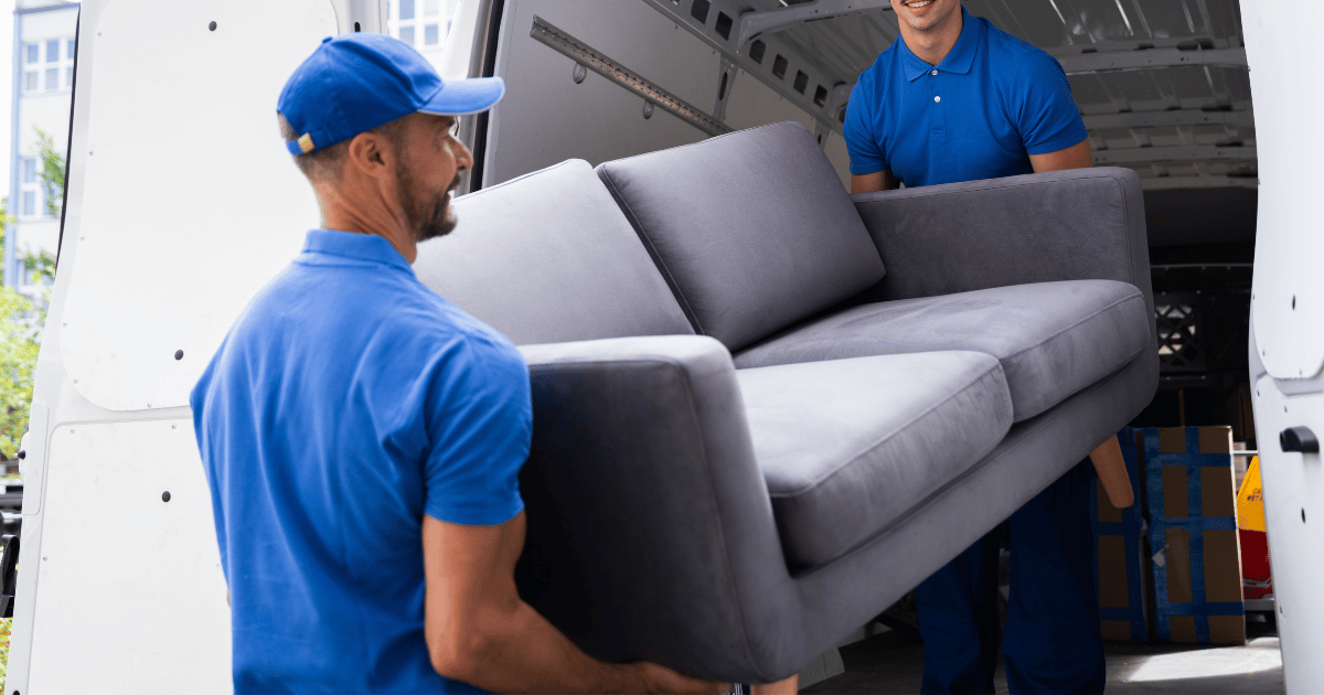 Movers carrying furniture to the moving truck